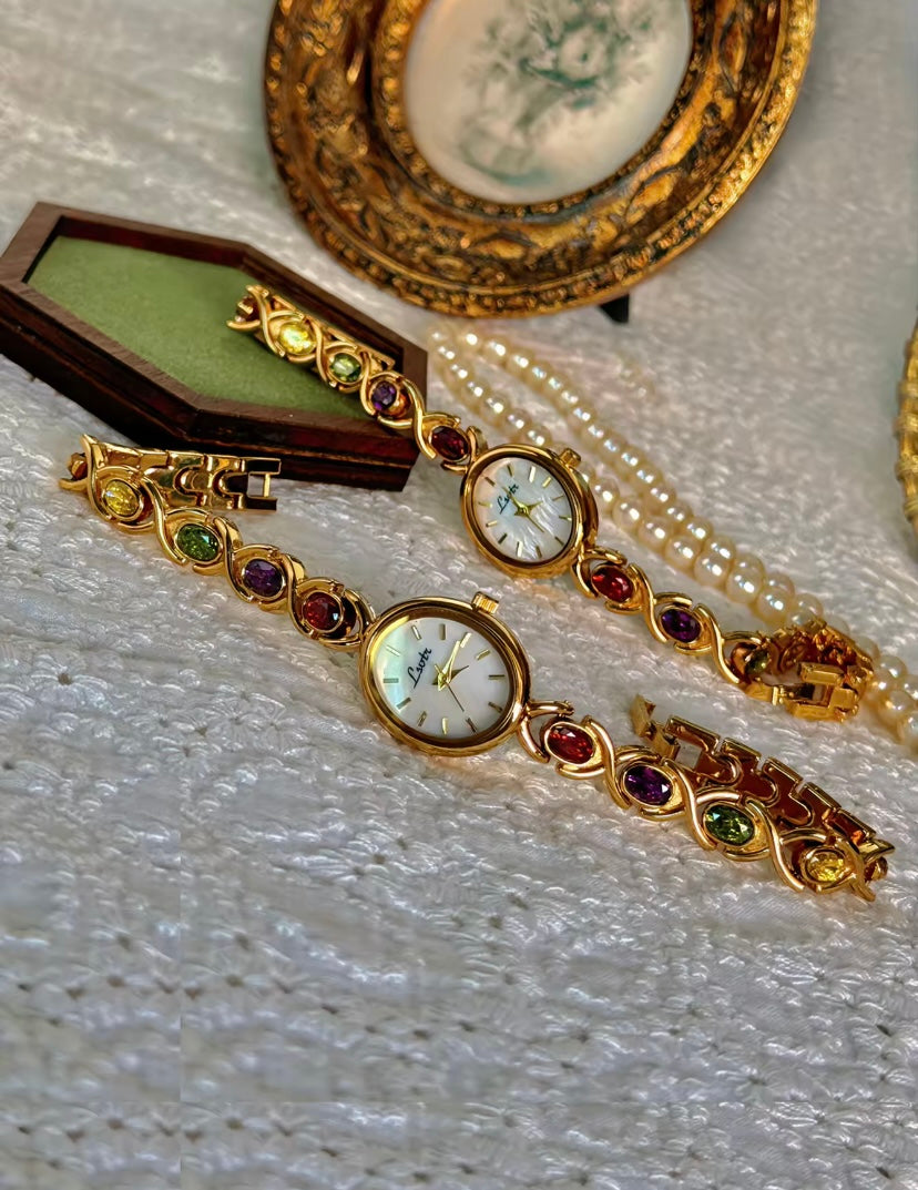 Gold Oval Quartz Face Embedded Coloured Gemstone Watch