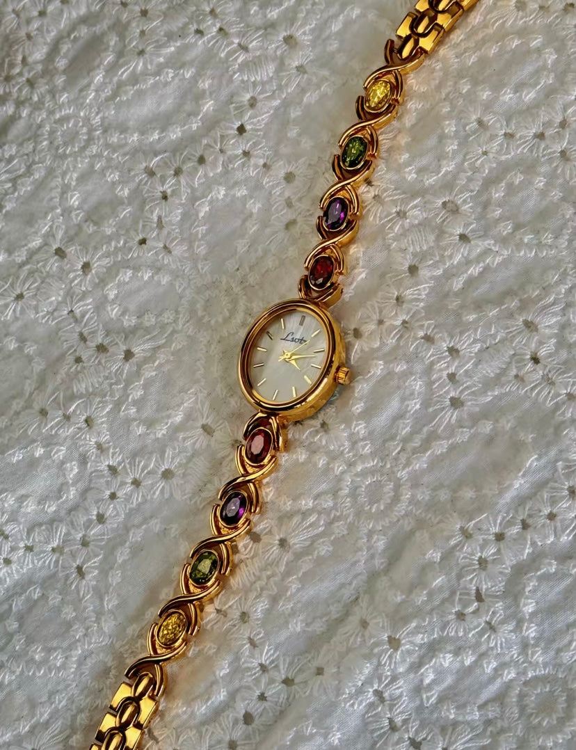 Gold Oval Quartz Face Embedded Coloured Gemstone Watch