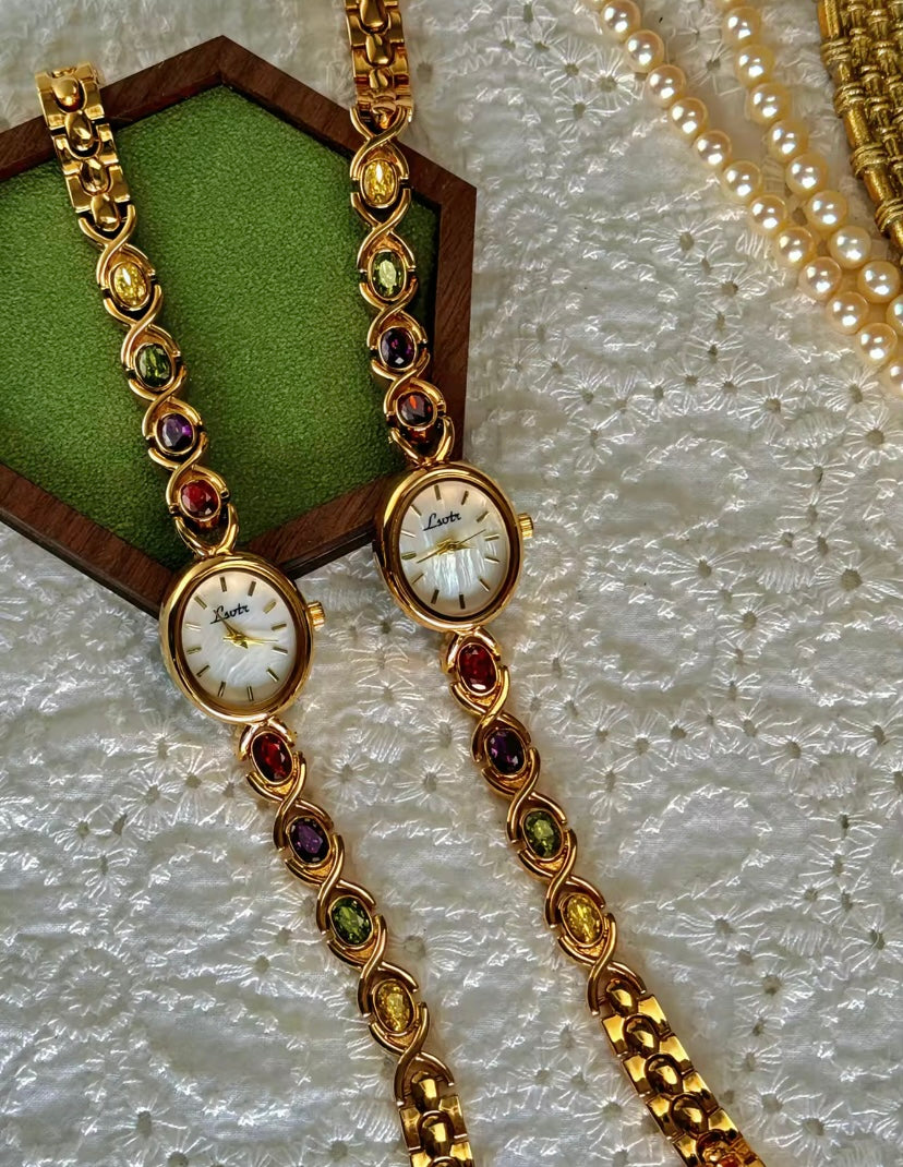 Gold Oval Quartz Face Embedded Coloured Gemstone Watch