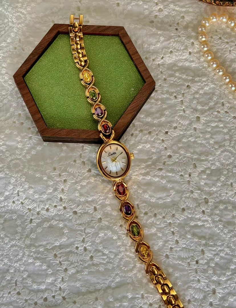 Gold Oval Quartz Face Embedded Coloured Gemstone Watch