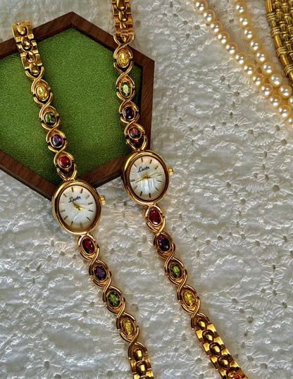 Gold Oval Quartz Face Embedded Coloured Gemstone Watch