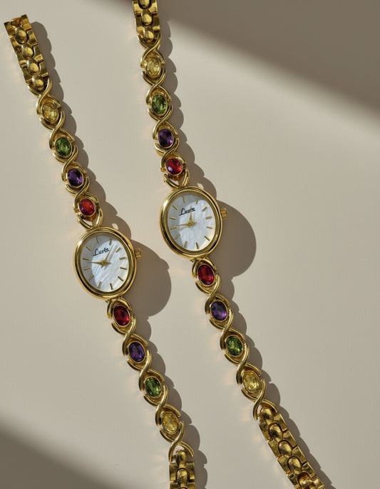 Gold Oval Quartz Face Embedded Coloured Gemstone Watch