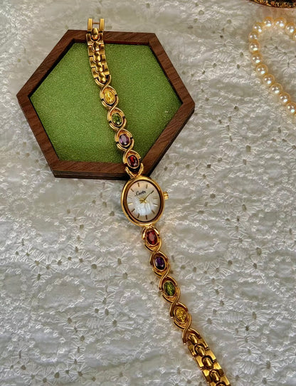 Gold Oval Quartz Face Embedded Coloured Gemstone Watch